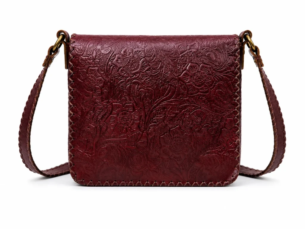 Model wearing Handmade Floral Embossed Leather Crossbody Bag - Burgundy - ASL Egypt