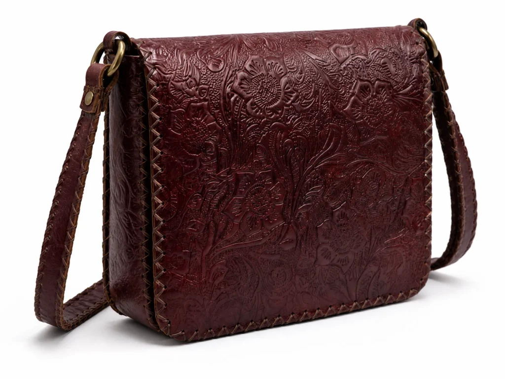Detail view of Handmade Floral Embossed Leather Crossbody Bag - Burgundy - ASL Egypt