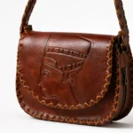 Detail view of Handmade Nefertiti Leather Crossbody Bag - Brown - ASL Egypt