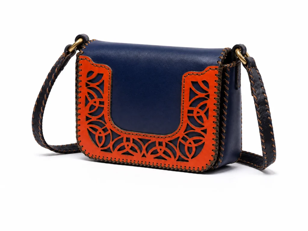 Detail view of Handmade Leather Crossbody Bag - Navy and Orange Filigree - ASL Egypt